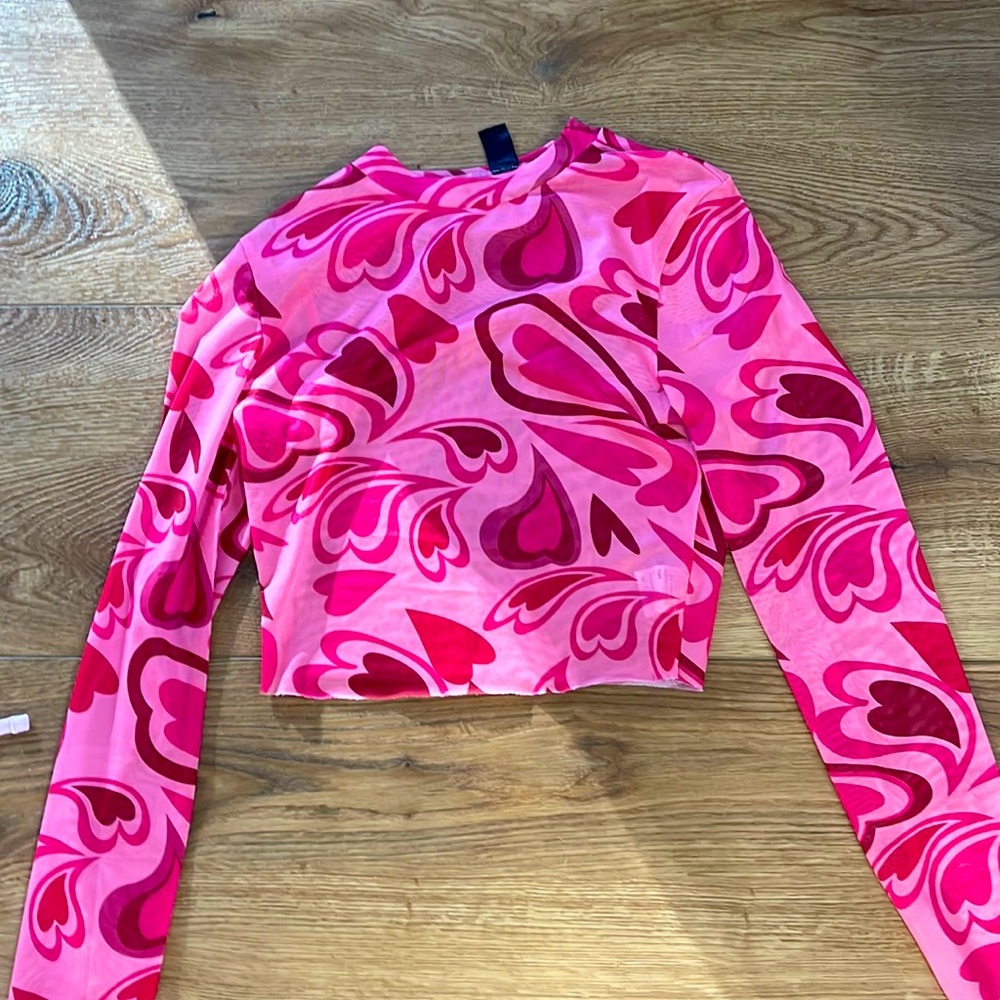 This shirt is perfect for wearing over a pink or red shirt!
